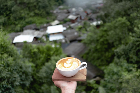 Coffee cup at small village in deep valley in Mae Kampong, Chiangmai, Thailand.
