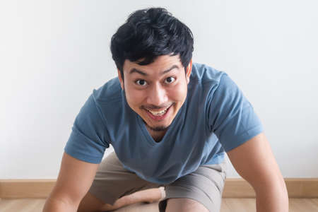 Funny and playful teasing of Asian man acts like a beast roar.の写真素材