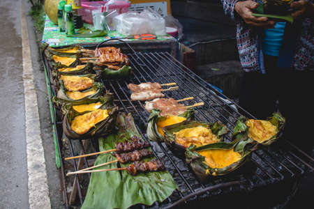 Khai Pam or Grilled Egg on Banana Leaf, street food in Northern of Thailand.の写真素材