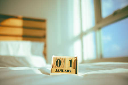 Closeup of wooden pieces with tex 01 JANUARY in the concept of new year.の写真素材