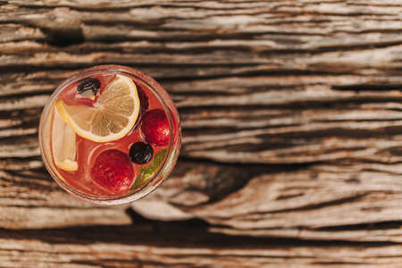 Mixed Fruits Italian soda for summer refreshment served on wooden table.の写真素材