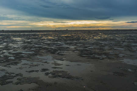 Low tide showing big area of mud sea in the evening.