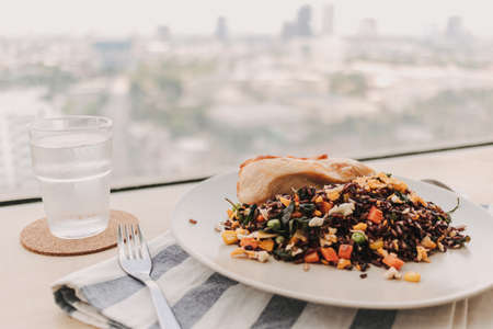 Homemade brown fried rice with chicken breast. Concept of diet food for health.の写真素材
