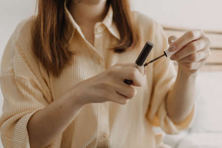 The makeup artist is using makeup tools applying to the client.の写真素材