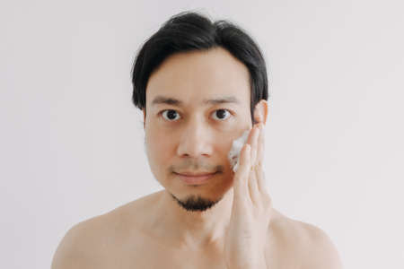 Shirtless Asian man show off his face and skin for skincare product.の写真素材