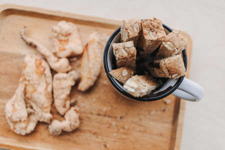 Set of bread chocolate dips with hot cocoa on wooden plate.の写真素材