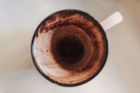 Finished empty hot cocoa in a mug served in a cafe in the morning.の写真素材