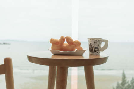 Table and chairs on the balcony with sea view. Summer travel concept.の写真素材