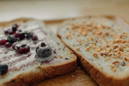 Break time meal sandwich on office wooden desk.