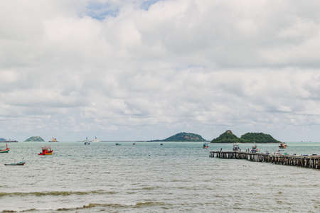 Sea view of gulf of Thailand with fisherman boat and small islands.