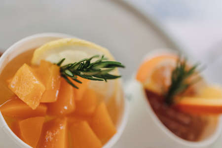 Close up fresh fruit soda drink in paper cup in the cafe.の写真素材