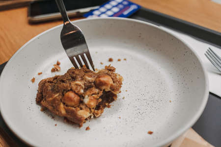 Close up of pieces of soft cookie being eaten with fork.の写真素材