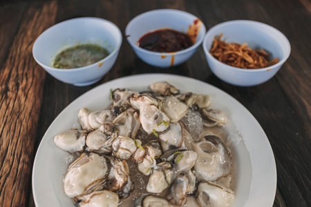Thai seafood Fresh Oyster with three sauces served on ice.