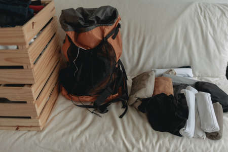 Prepare clothes into the backpack for the travel trip.の写真素材