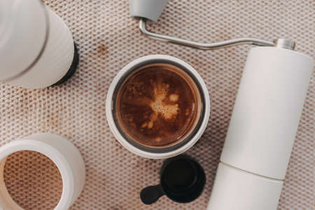 Espresso coffee crema with grind and french press manual equipments.