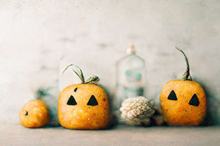 Pumpkin ghosts Halloween holiday abstract background by digital painting.