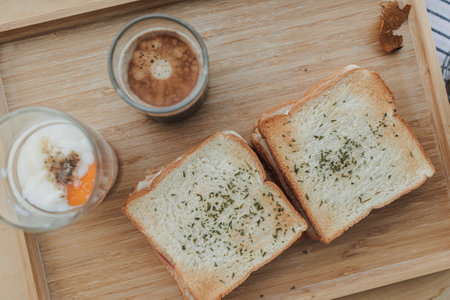 Sandwich soft boiled eggs and one shot of espresso coffee breakfast set.