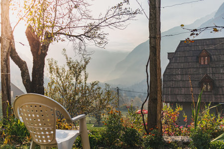 European village backyard garden with vines and mountain view in the morning.の写真素材