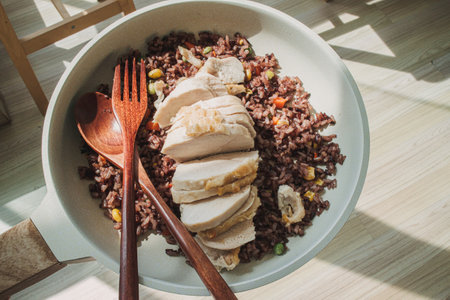 Fried purple rice with steamed chicken breast in concept of dietary.の写真素材
