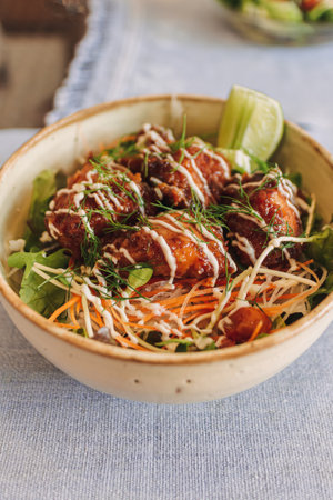 Japanese teriyaki rice with topping sauce served in a bowl.の写真素材