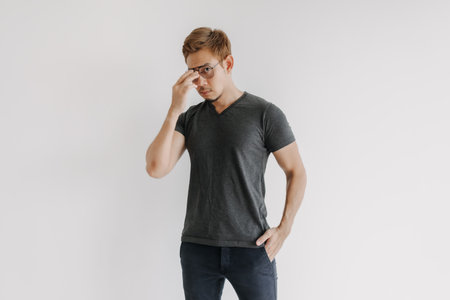 Cool and serious colored hair Asian man in black t-shirt isolated on white.