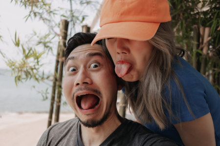 Funny face of selfie lovely asian couple man and woman.の写真素材