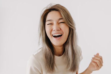Happy smile and laugh face asian woman portrait isolated on white background.の写真素材