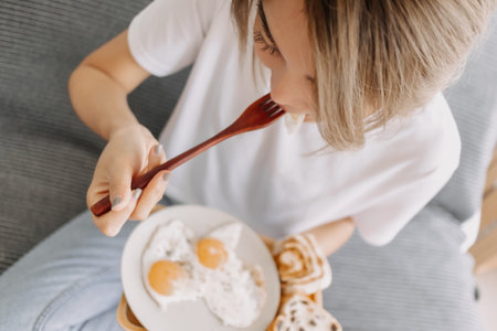 Portrait of asian woman eating her simple and easy breakfast.