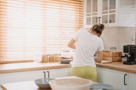 Funny candid moment of asian wife cooking for husband for the first time.の写真素材