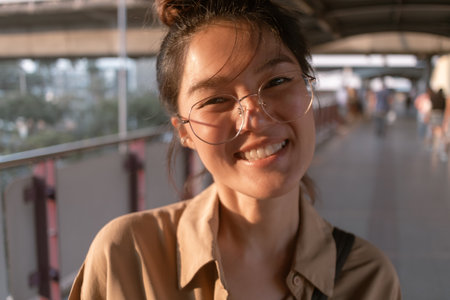 Close up of Asian woman make funny hilarious face to the camera.の写真素材