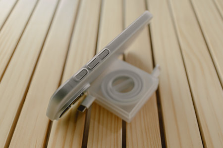 Smart mobile phone wear matte white case and cable case with phone standing function.の写真素材