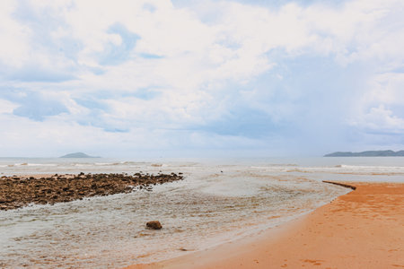 Red sand and cliff beach in Chumphon, Thailand.の写真素材