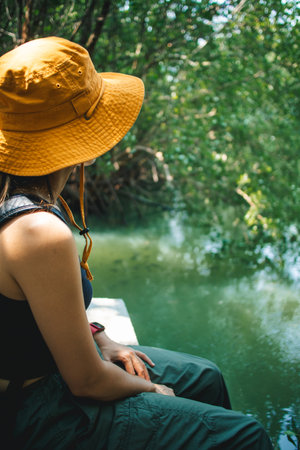 Lovely Happy Asian woman relax in the mangrove forest outdoor activity.の写真素材