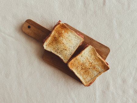 Close up homemade ham cheese sandwiches served on the wooden board.の写真素材