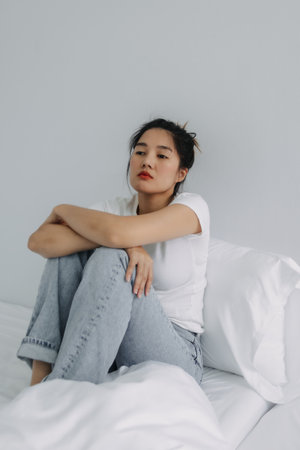 Sad and depressed asian woman stay alone in the room.の写真素材