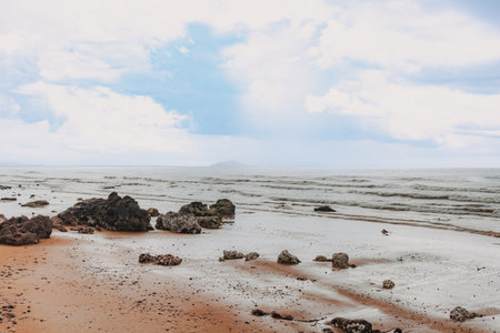 Red sand and cliff beach in Chumphon, Thailand.の写真素材