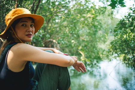 Lovely Happy Asian woman relax in the mangrove forest outdoor activity.の写真素材