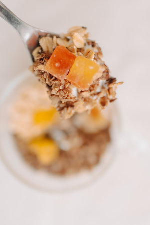 Close up of homemade yogurt snack cup on white table.の写真素材