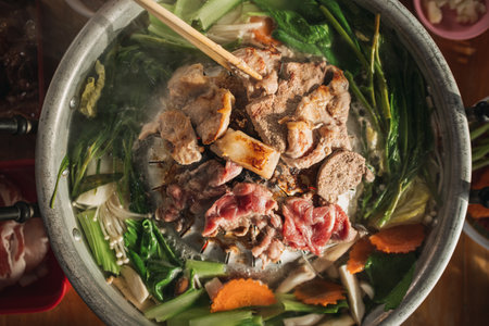 Close up of delicious Thai style pork BBQ buffet on hot pan.の写真素材