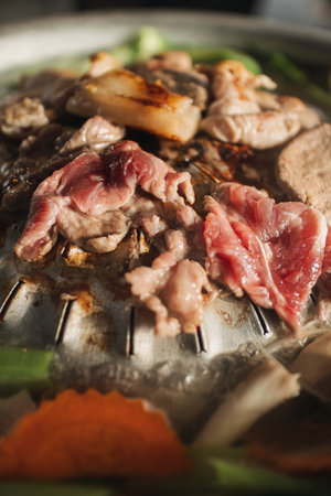 Close up of delicious Thai style pork BBQ buffet on hot pan.の写真素材