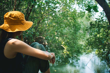Lovely Happy Asian woman relax in the mangrove forest outdoor activity.の写真素材