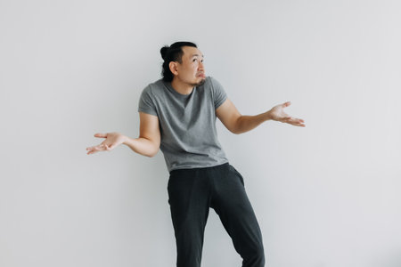 Never mind, no matter, not care. Full body of Asian man isolated on white.の写真素材