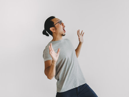 Half body photo of shock and surprise Asian man isolate on white background.の写真素材