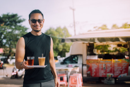 Asian tourist backpacker man buy morning coffee set on the street in local Asia.の写真素材