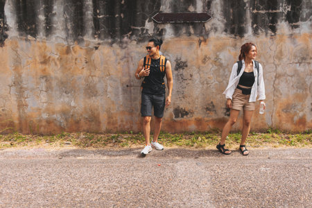 Asian couple tourist backpacker walking in Asia old town.の写真素材