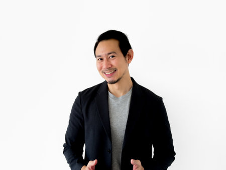 Half body portrait of smile and happy Asian business man isolated on white background.の写真素材