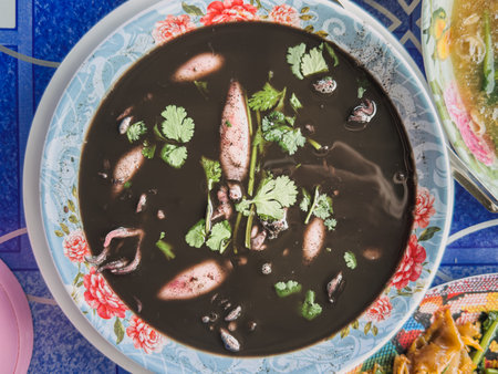 Thai Squid Ink Soup in a bowl served in local Thai restaurant.の写真素材
