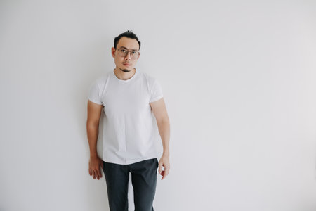 Asian man standing idle alone isolate on white background.の写真素材