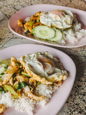 Khan Pad Ka Prao Ta Lay or Thai Rice and Stir-Fried Seafood with basil in local restaurant.の写真素材