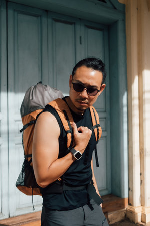 Tourist backpacker Asian man traveling in Asia old town.の写真素材
